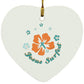 White heart-shaped flower ornament with hanging gold loop and colorful floral design.